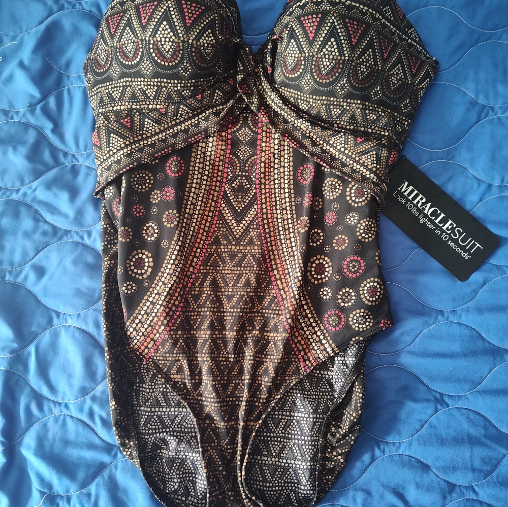 Size 16 MIRACLESUIT, strapless swim suit in excellent condition multi colored.